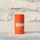 dōTERRA On Guard™ Stick + Echinacea auf Steinhintergrund – Wohlbefinden